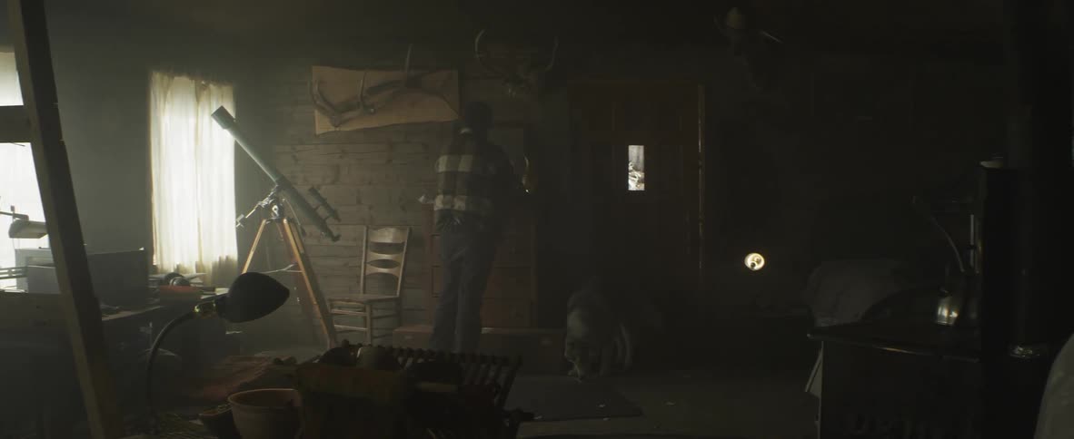 A man runs in the room with his dog