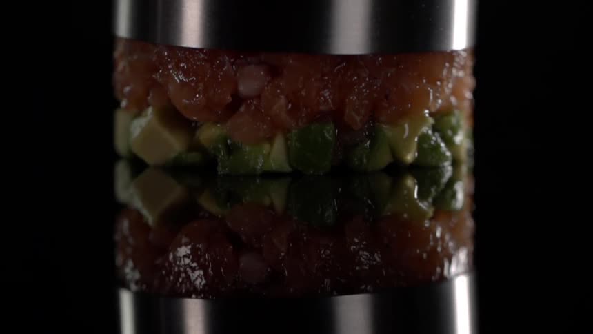 A cylinder is lifted from a prepared dish