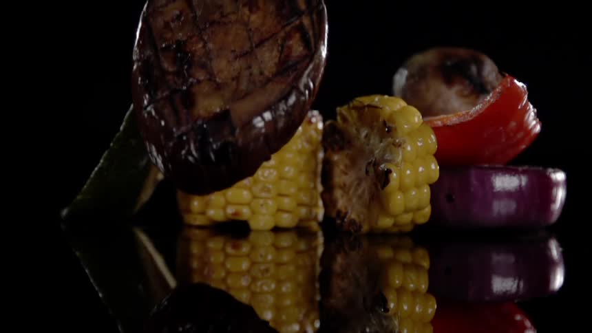 Cooked vegetables are displayed on the counter