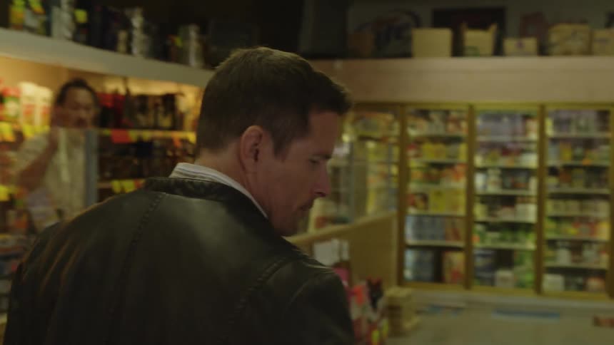 A man does some shopping in the grocery store