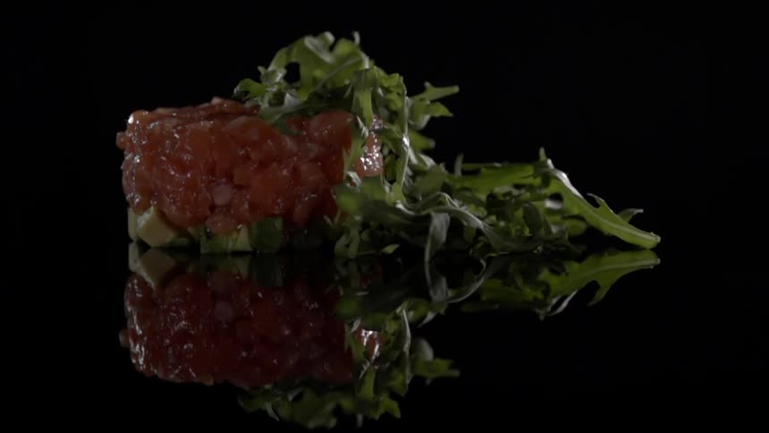 Garnish is dropped on the food