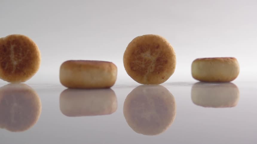 Three biscuits fall down by a first biscuit