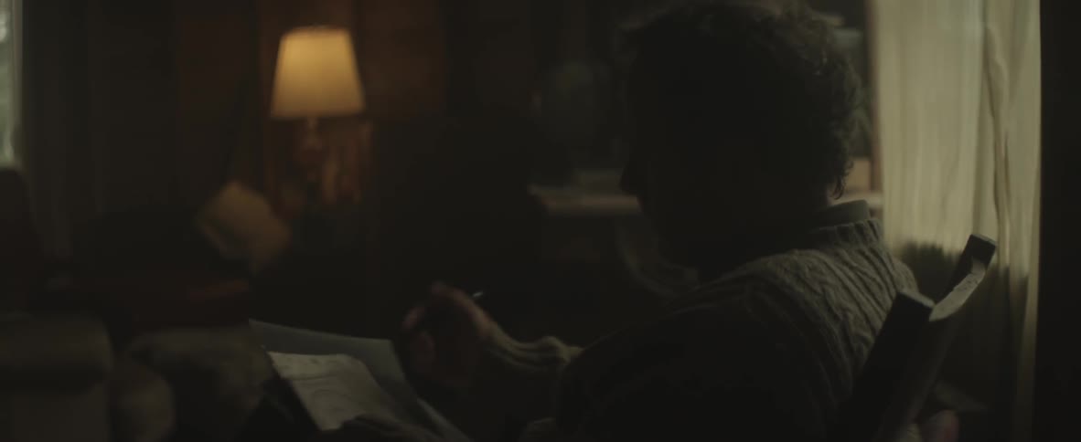 Man looks through several pieces of paper