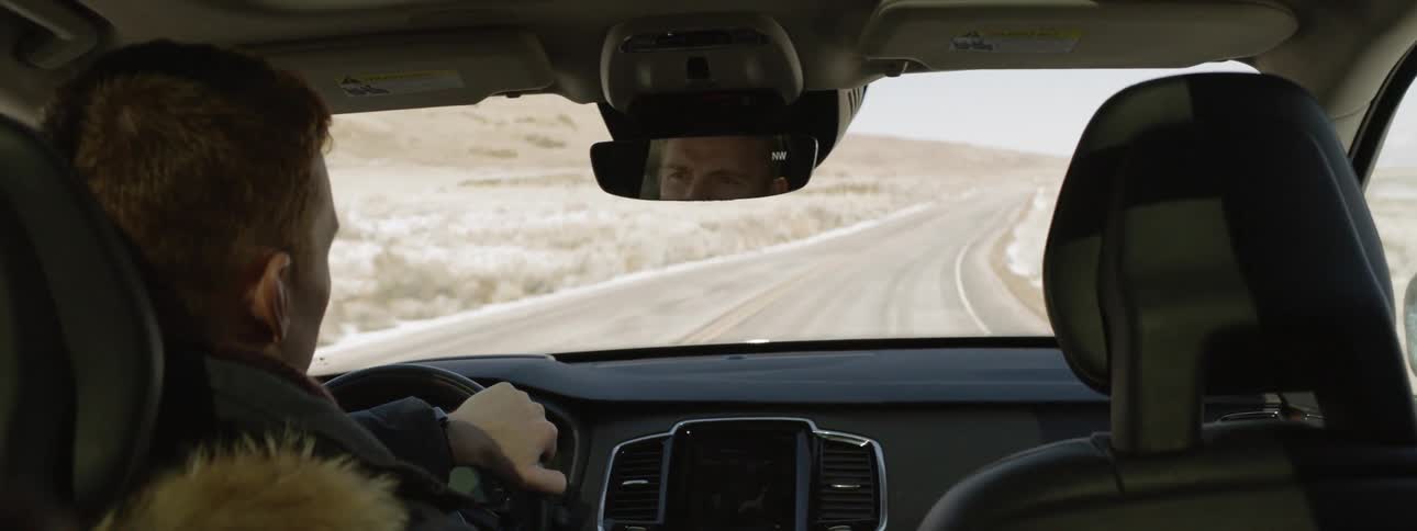 Man drives on a rural road
