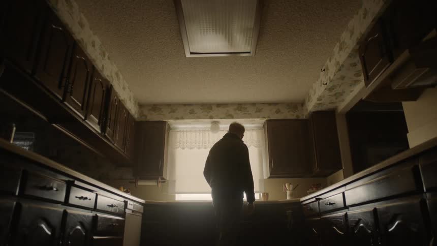 Man standing in kitchen