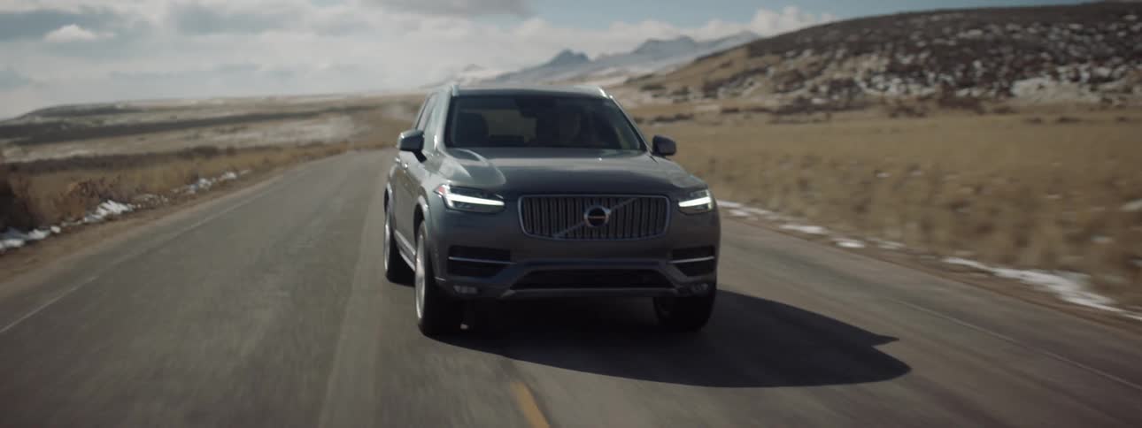 An suv is driven on a rural road