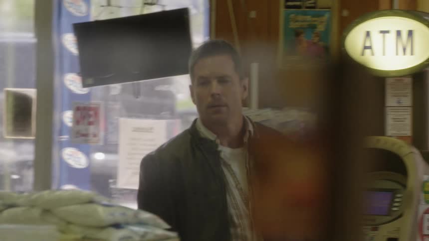 Man shops in a small convenience store
