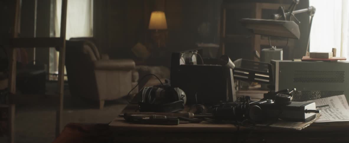 A cluttered desk in the sunlight