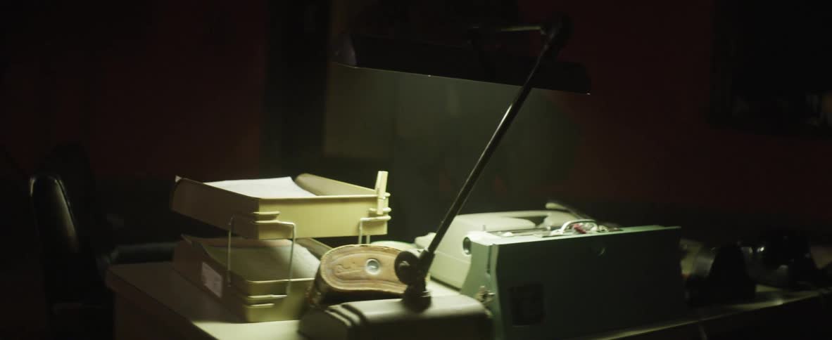 A lamp illuminating a desk