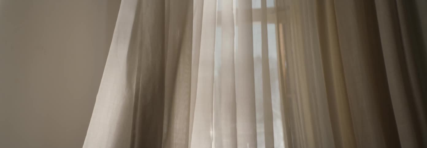 The curtains blow in the wind