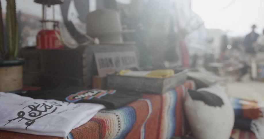 The table has many different items from hats to shirts