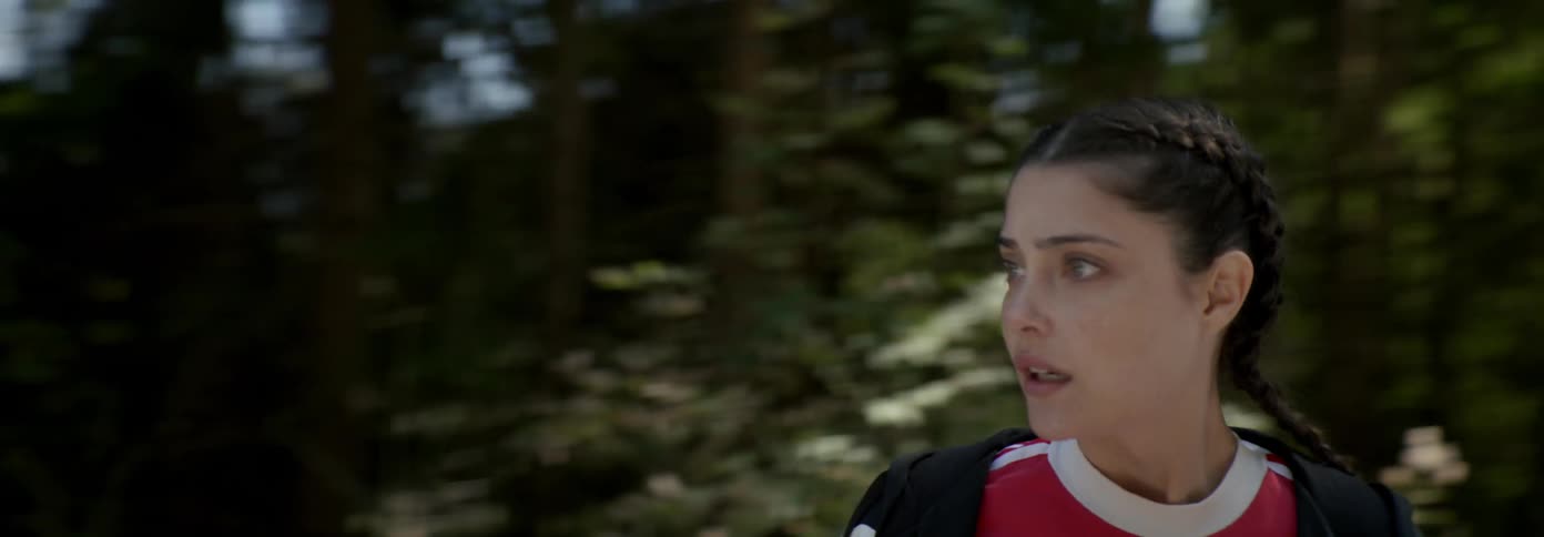 Woman panics while standing on a mountain road