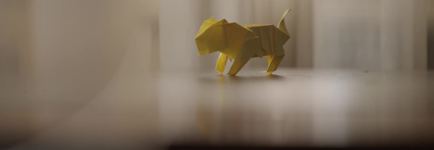 Origami animal stands on a table top