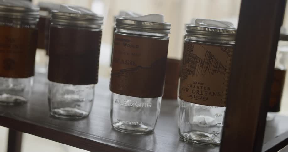 The shelf is covered with many jars
