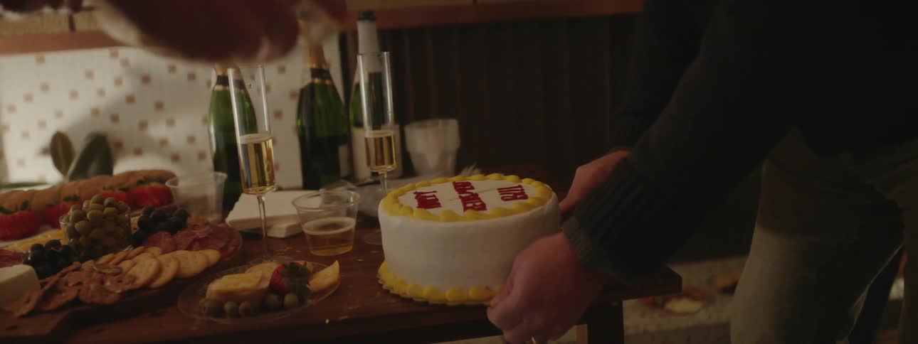 A man cuts a cake in celebration