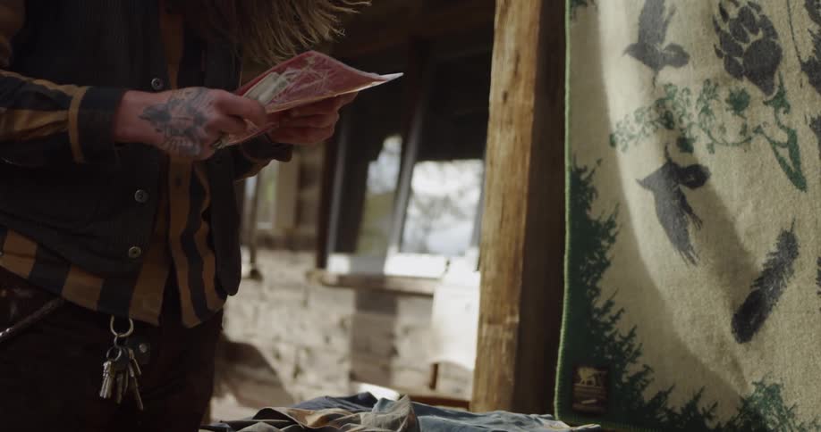 A person is examining a flyer in their hand