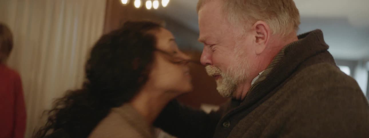 A man gives a woman a hug