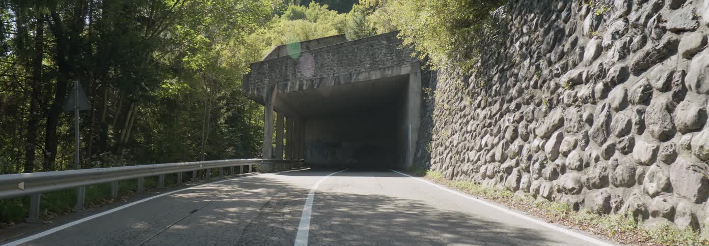 A tunnel stands on a mountain road