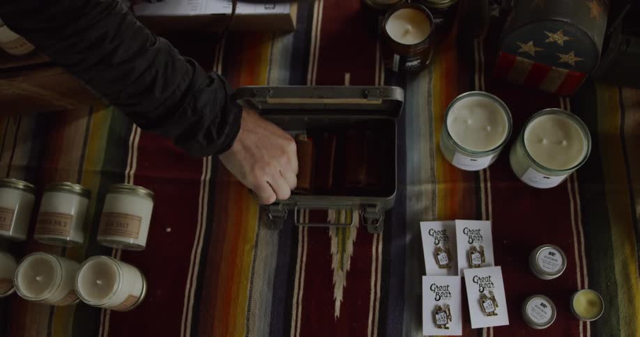 Man removes a card from a small box
