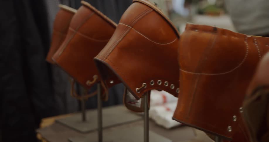 Unfinished shoes are displayed in a shoemaker's shop