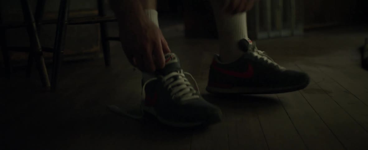 A person tying their shoes