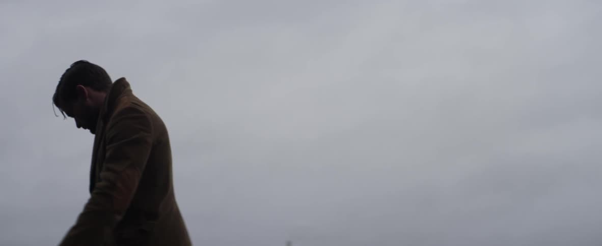 Man paces around in a foggy area