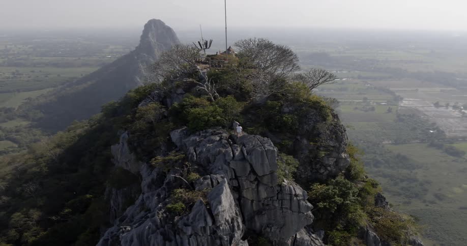 The tall mountains are covered with trees