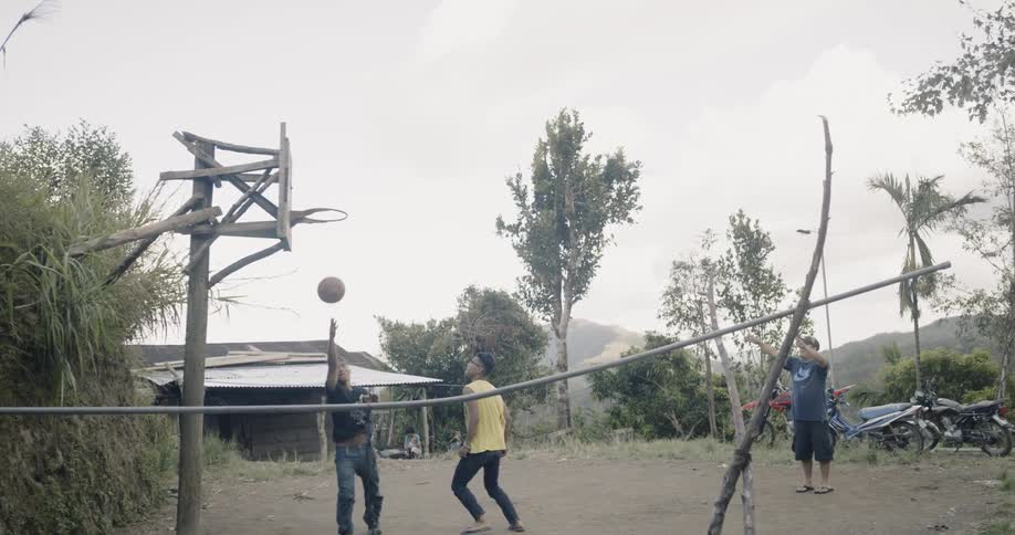 People play basketball in the yard