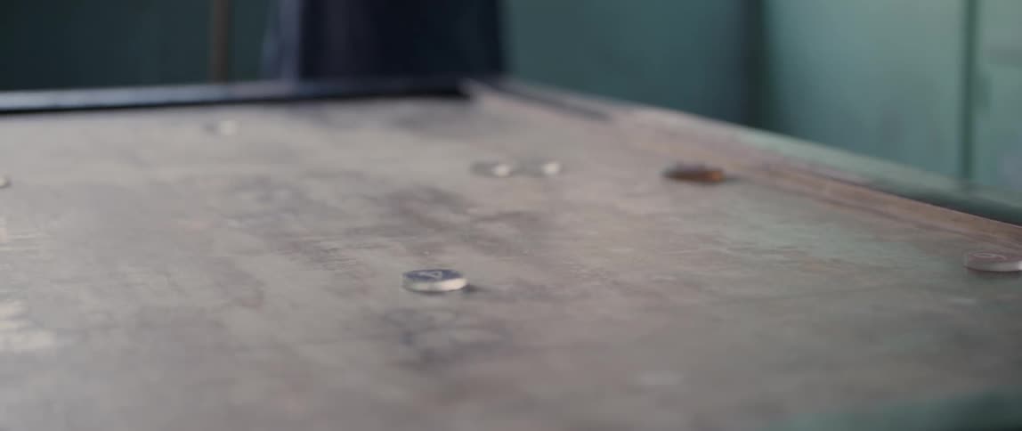 People play a game with pool cues