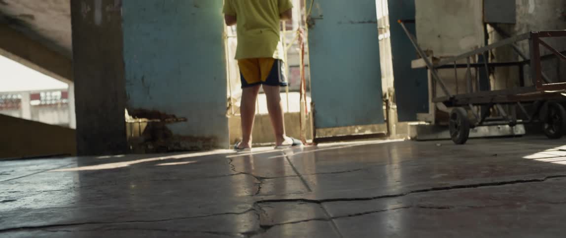 Boy looks out a window