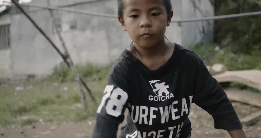 Child dribbles a basketball outside