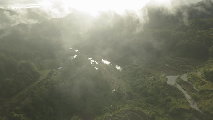 The mountains ahead are covered with clouds