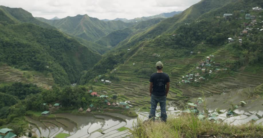 A man stands in mountains