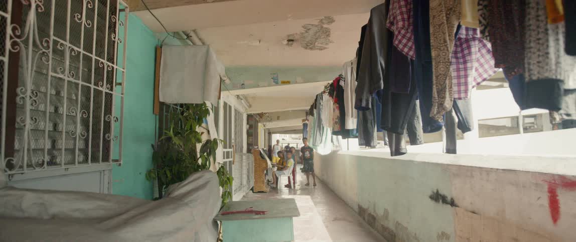Laundry hangs on an apartment balcony
