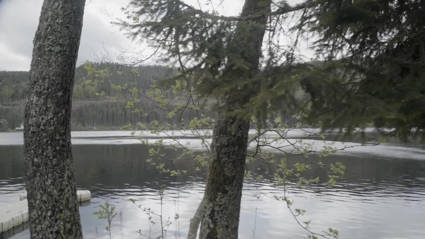 Lake waters flow under overcast skies