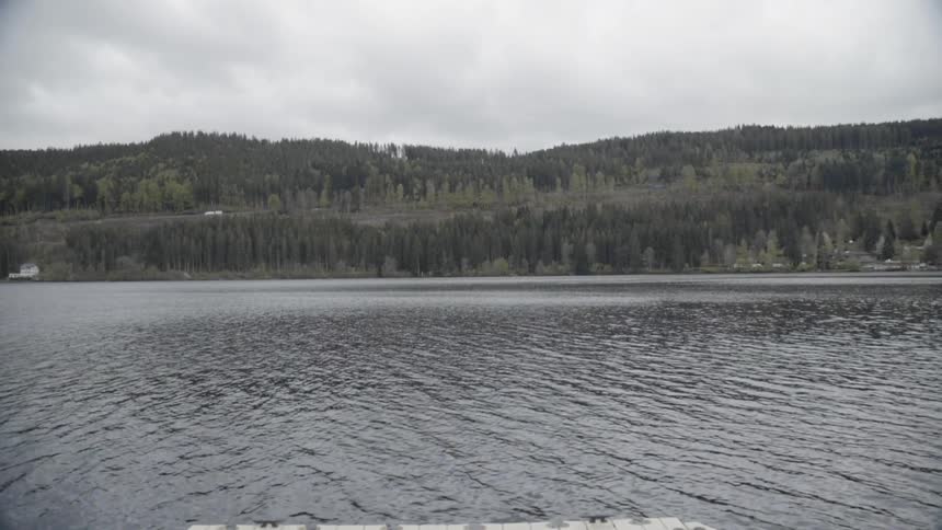 A lake flows around a dock