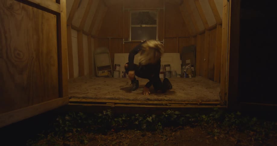 A woman dances in the very small room