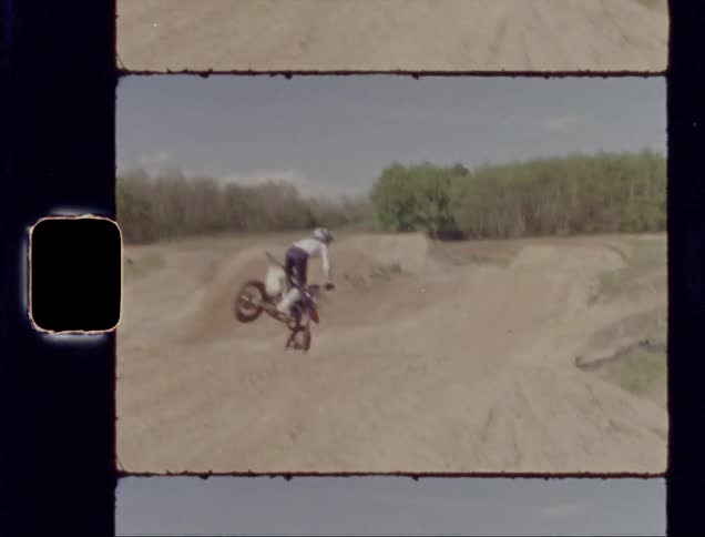 Person rides a bike on a dirt track