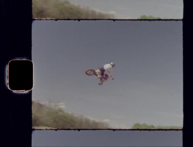 The dirt bike flies off after hitting a hill in the dirt