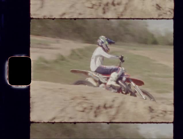 A young man rides a dirt bike on ramps