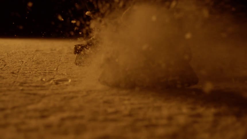 A person is ice skating at night
