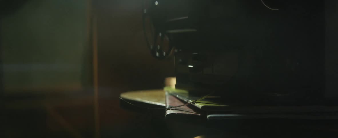 Light reflecting off projector equipment in a dark room