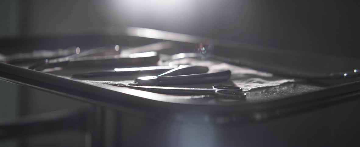 Surgery tools sit on a tray