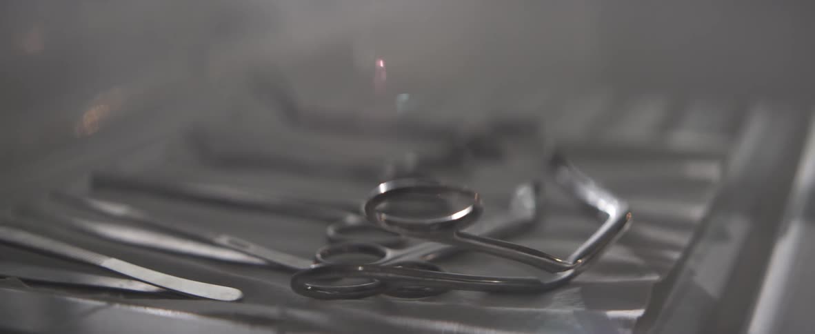 Light shining over doctors instrument tray