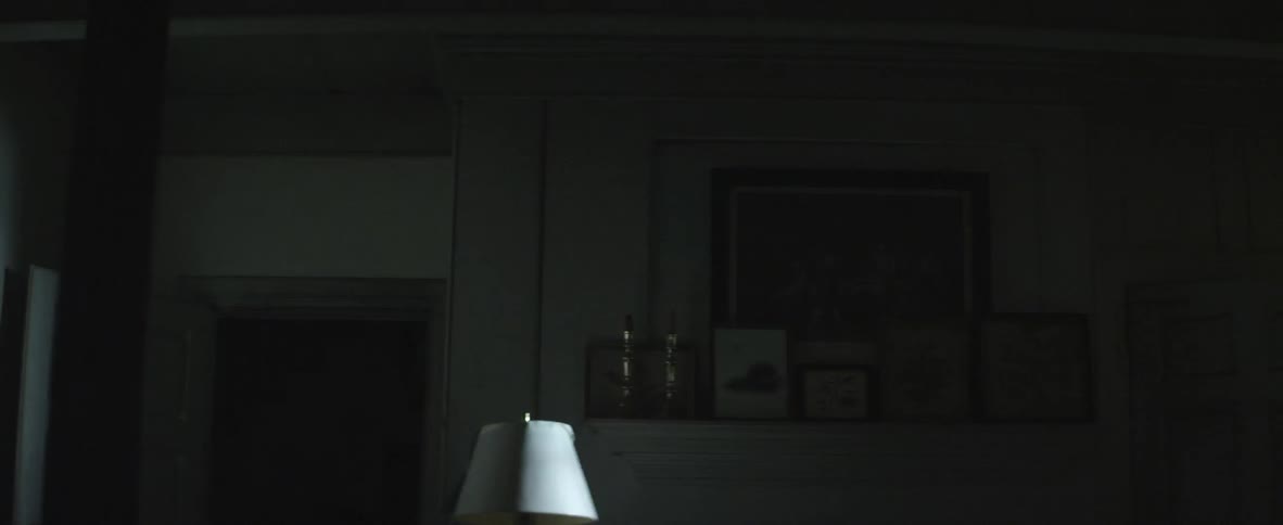 Headlights shining into a dark living room