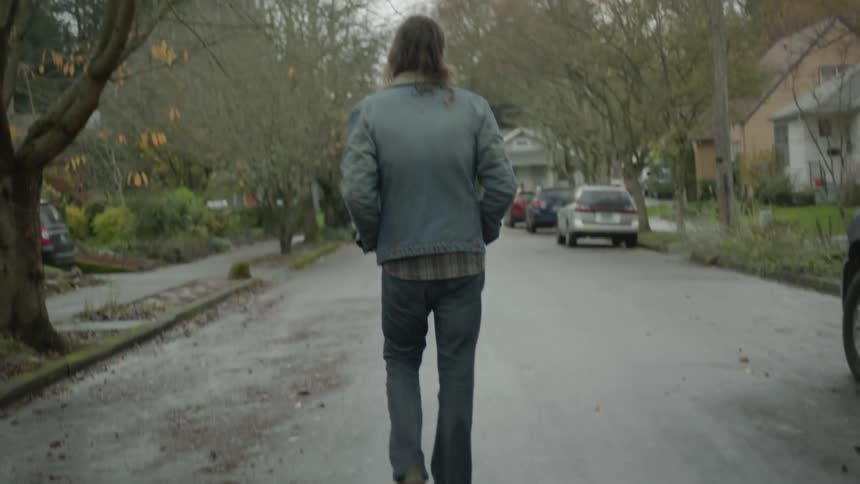 Man walks on a residential street