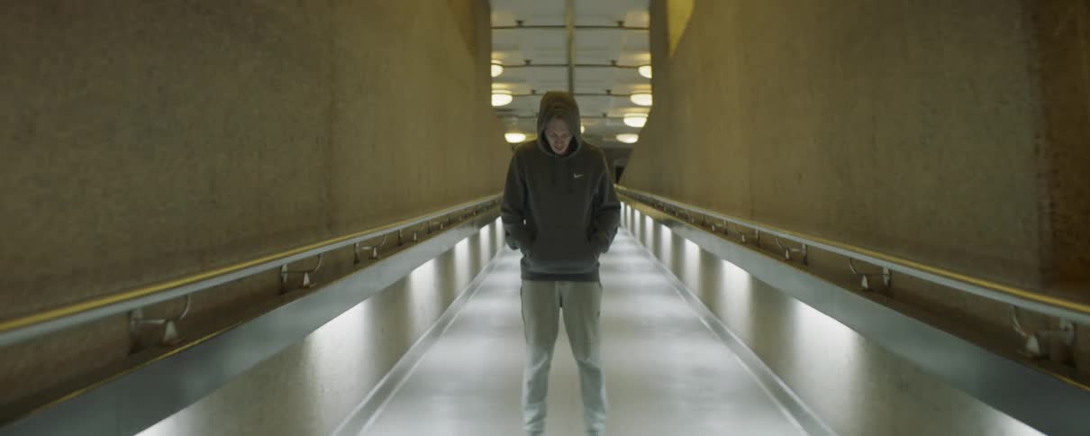 The man stands blocking the path