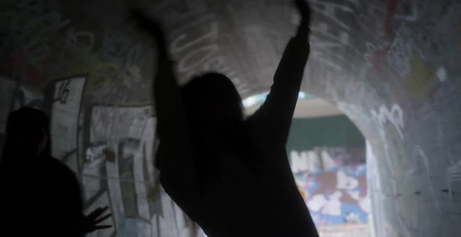 Woman dance in a tunnel
