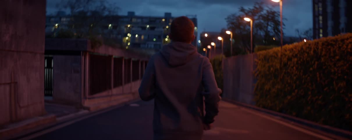 A man jogs at dusk
