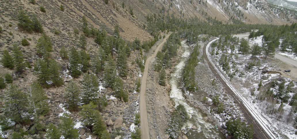 The trails run at the bottom of the hills ahead